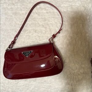 Patent red handbag